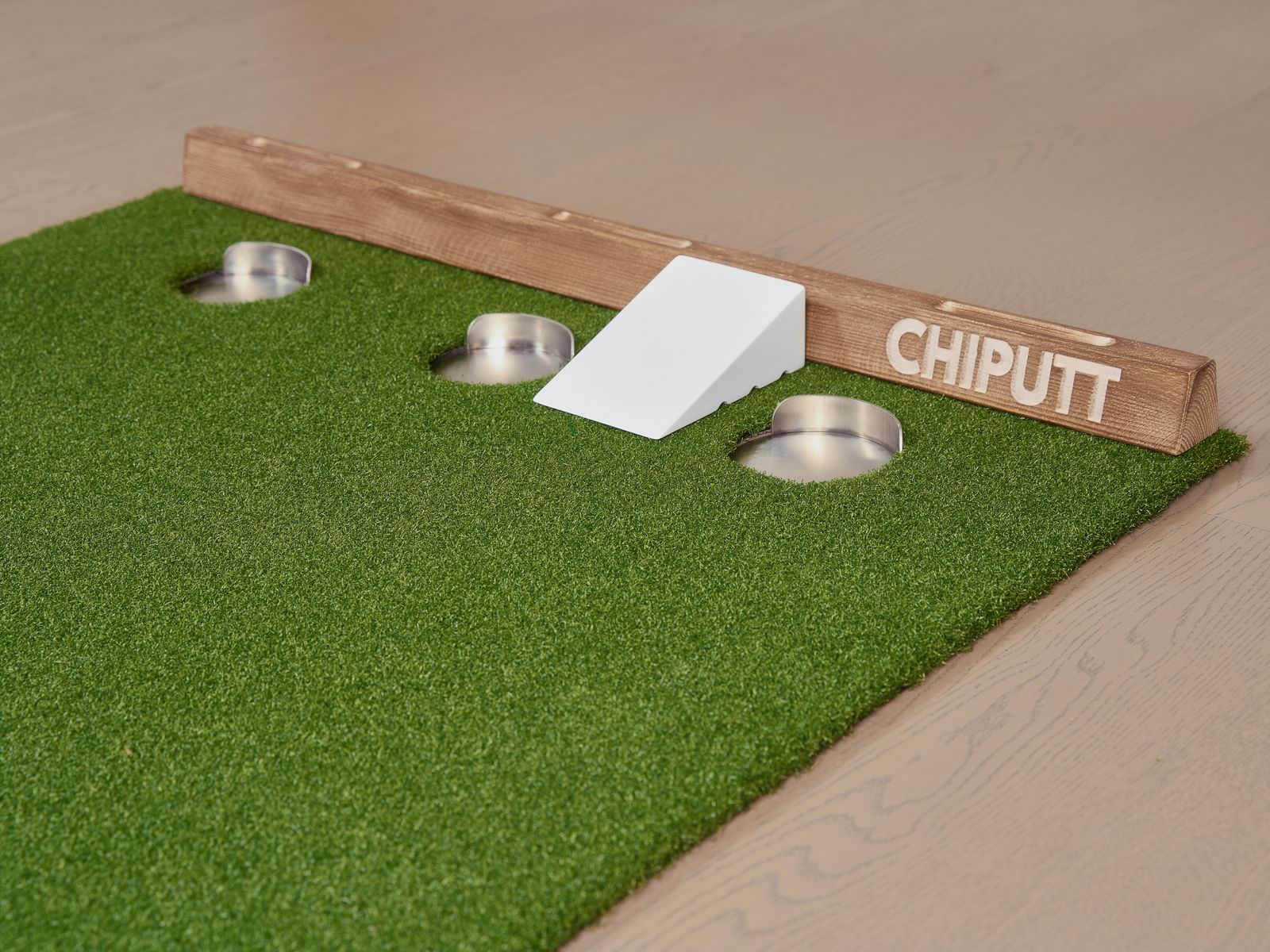 Chipping and putting practice mat with golf balls