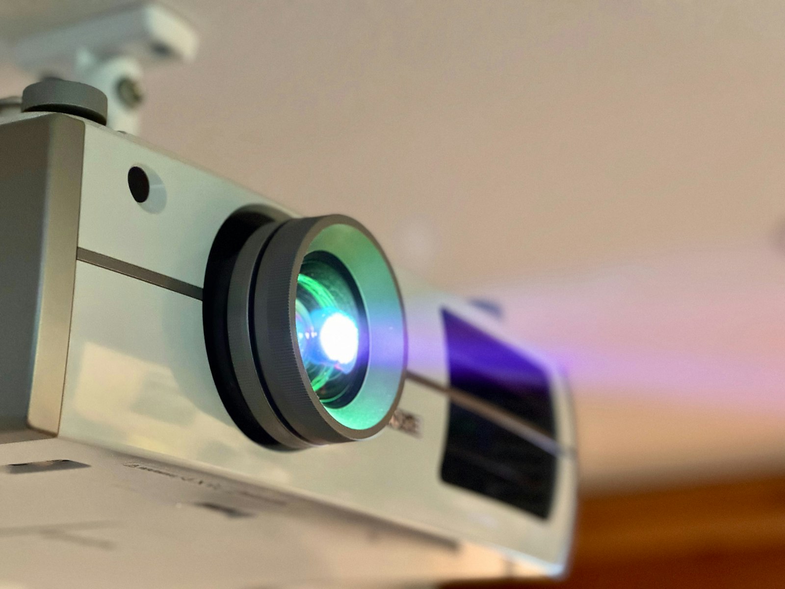 A home projector mounted on a ceiling, close up