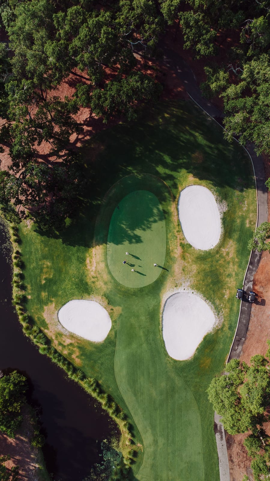 Aerial view of a real golf course with sand bunkers and fairways