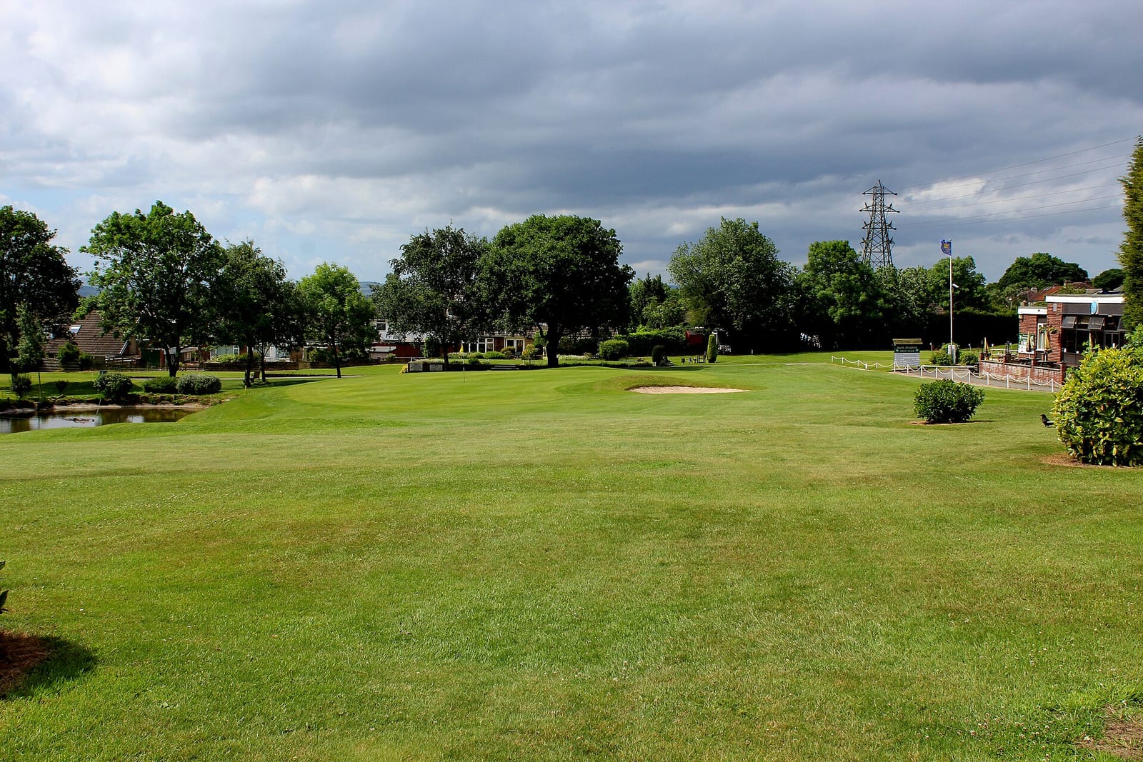 A real golf course fairway lined with trees
