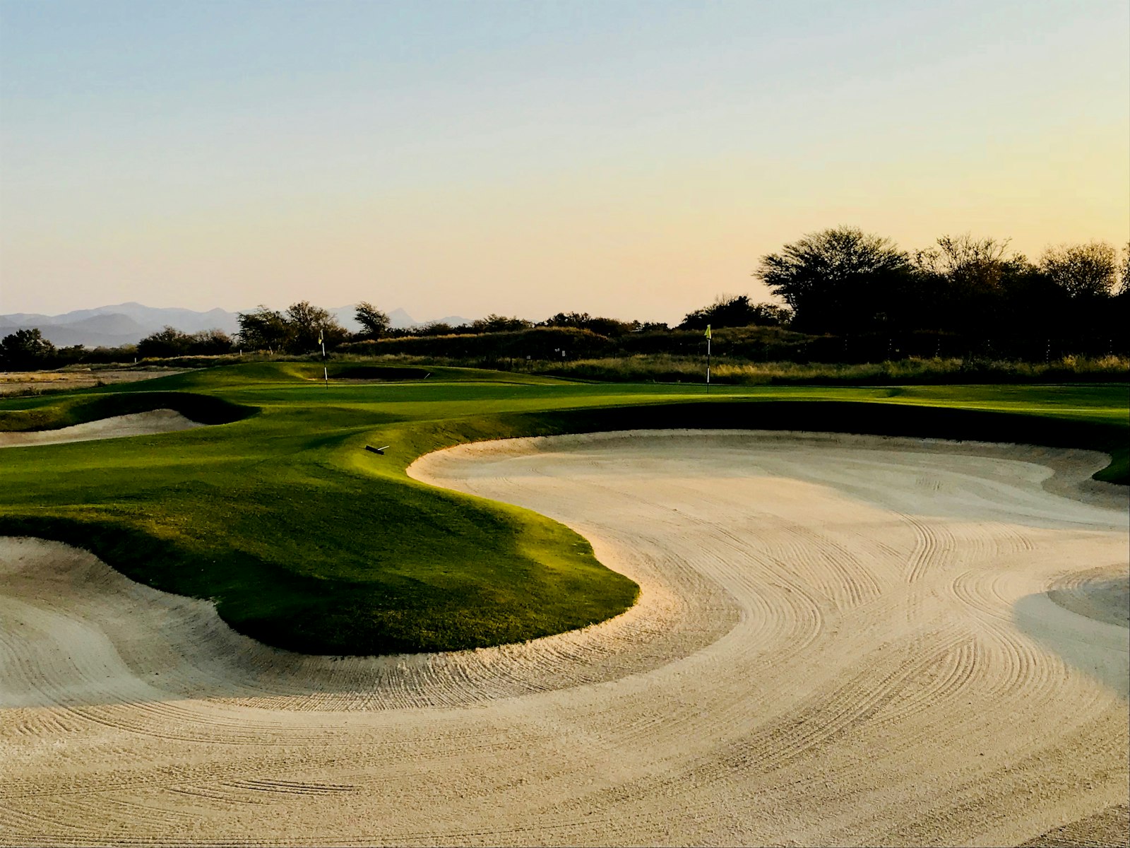 A real golf course fairway under a clear blue sky