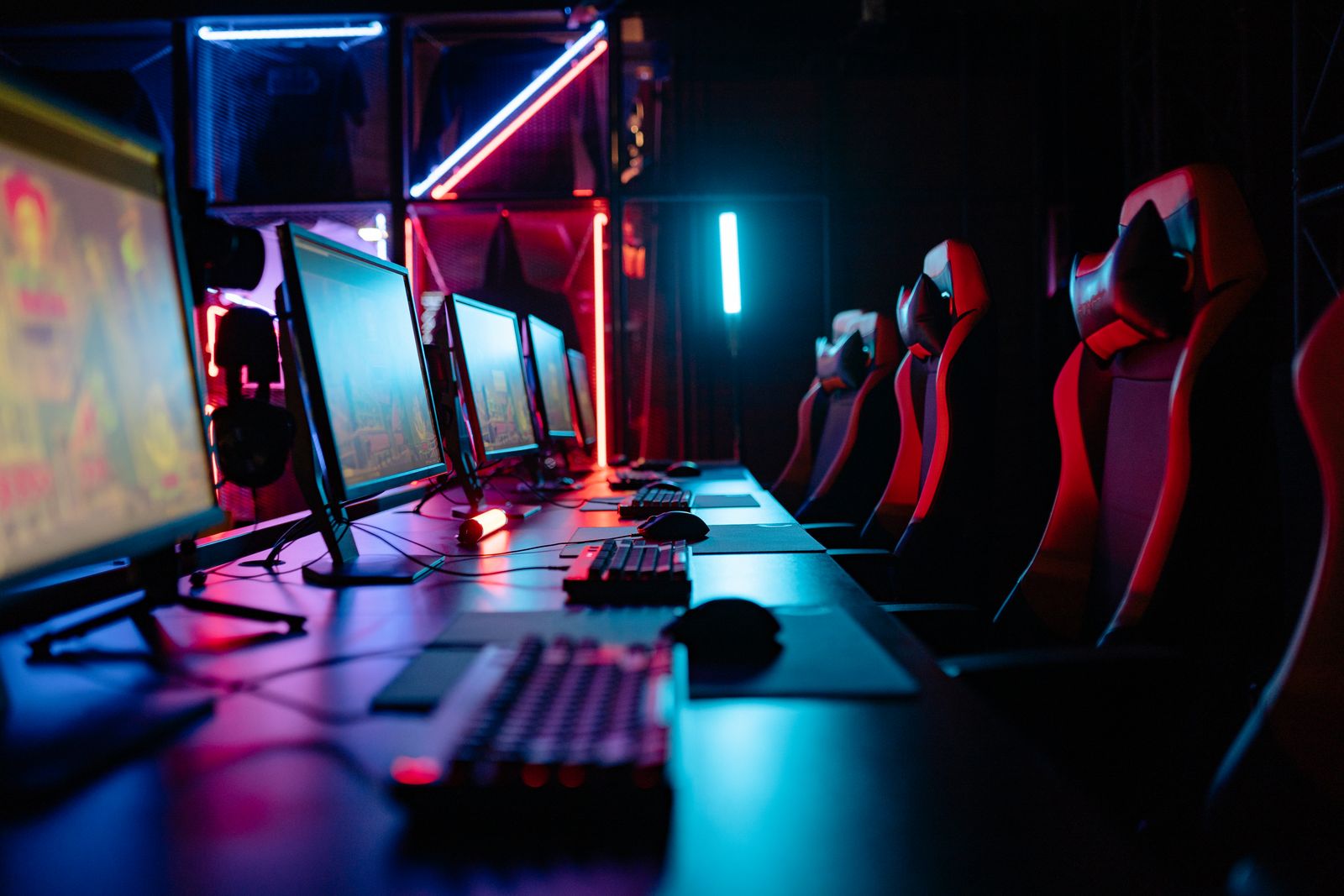 A multi-monitor gaming room set up for a group of players