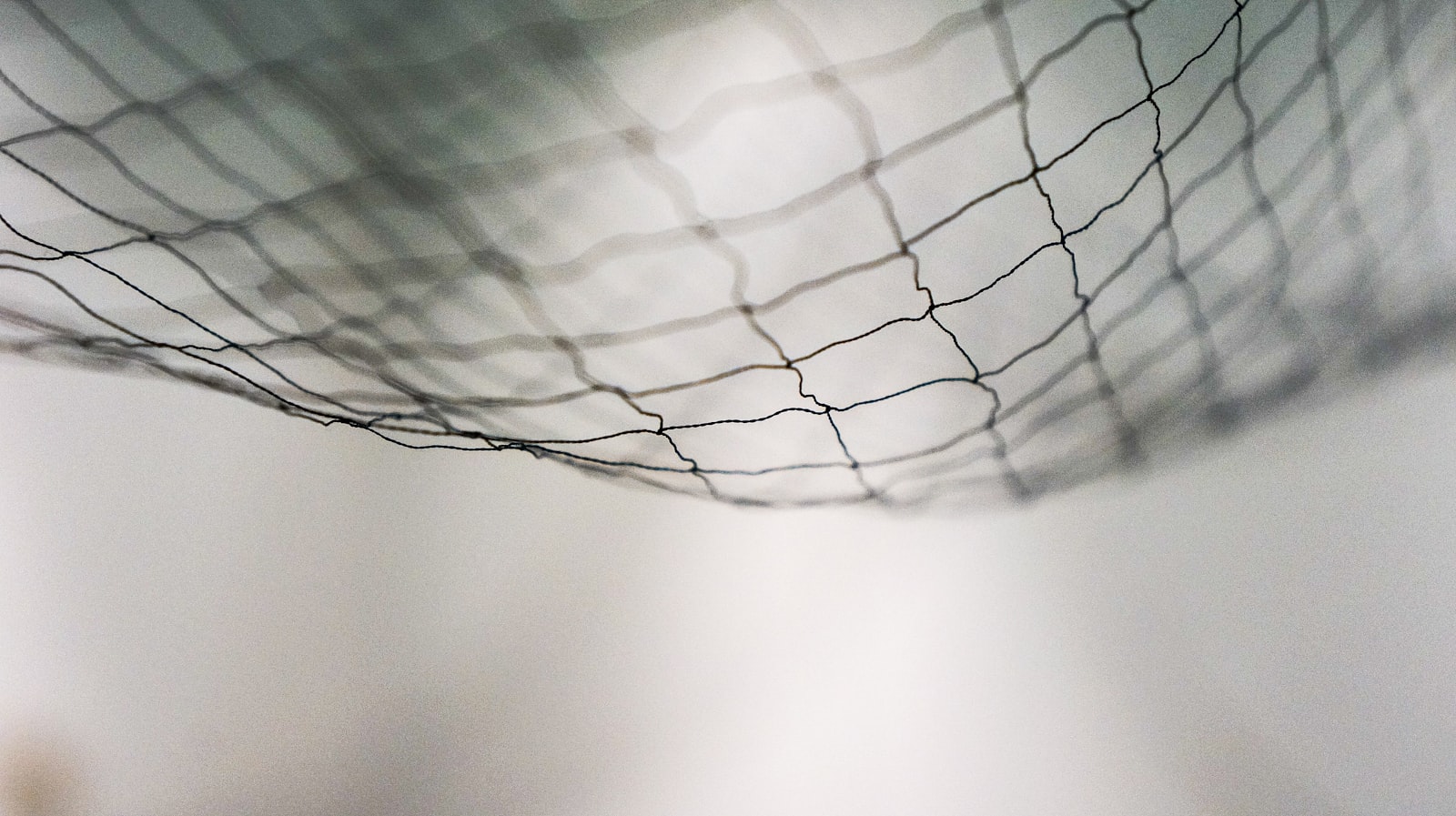 A close-up view of black netting mesh weave