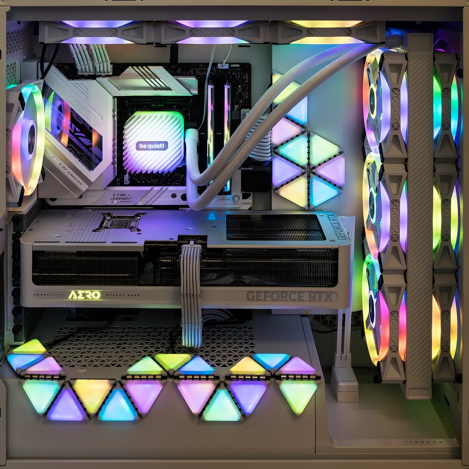 Interior of an open PC case mid-build, motherboard and cabling visible