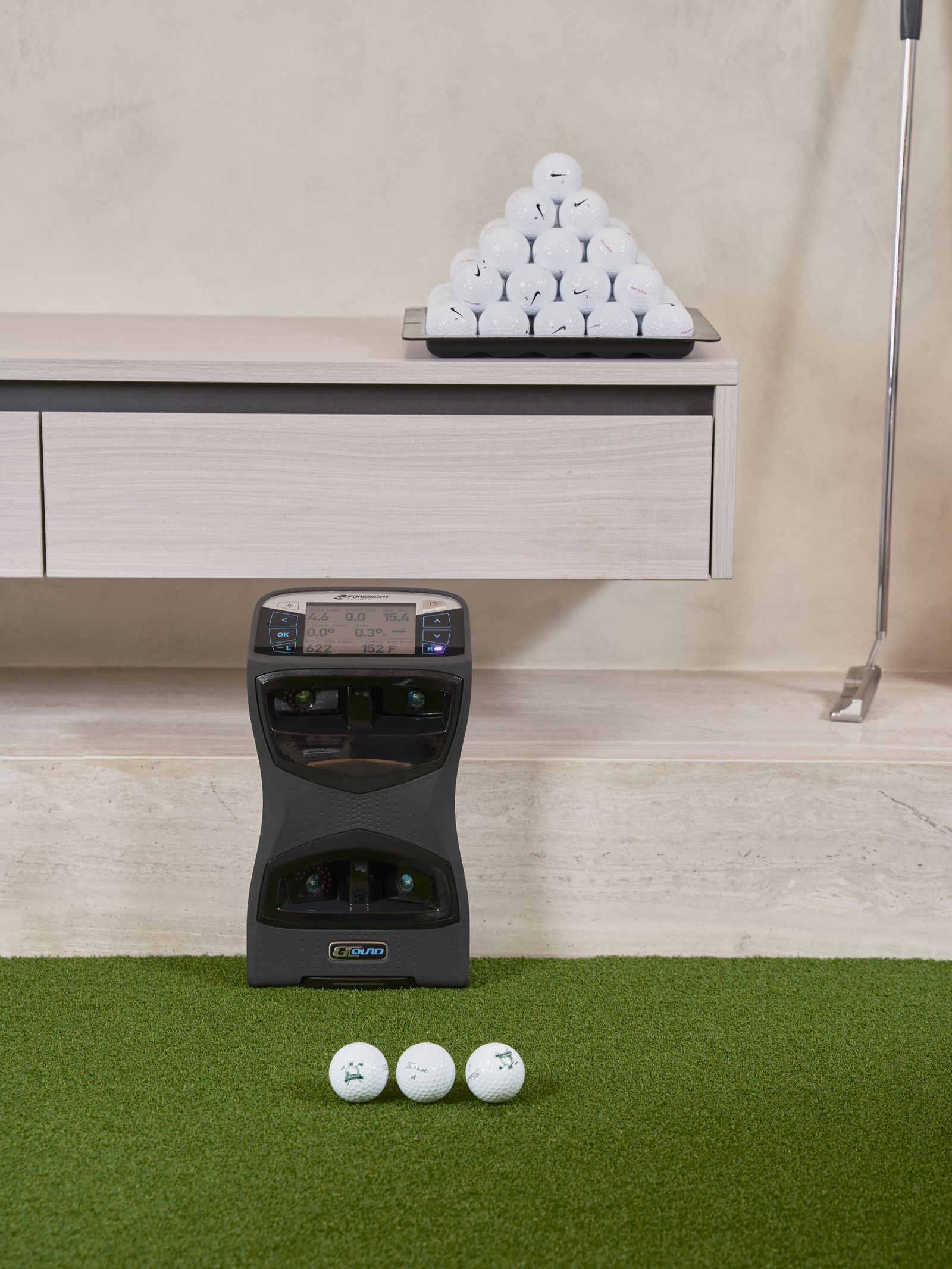 A professional indoor golf training setup with practice equipment